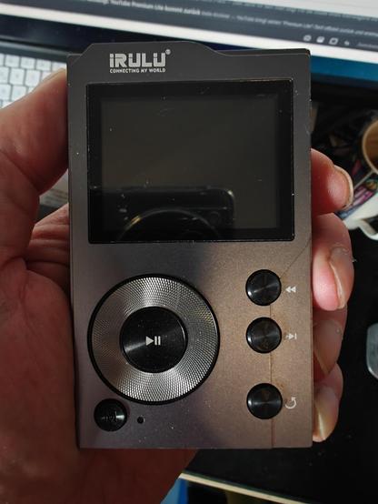Hand holding an irulu mp3 player