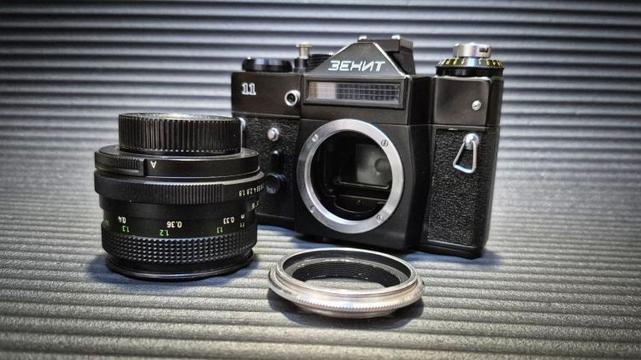 A Zenit 11 SLR camera, Pentacon 50mm f1.8 lens, and an M42-mount lens reversing ring.