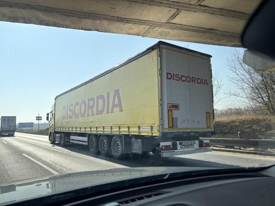 Discordia company yellow semi truck