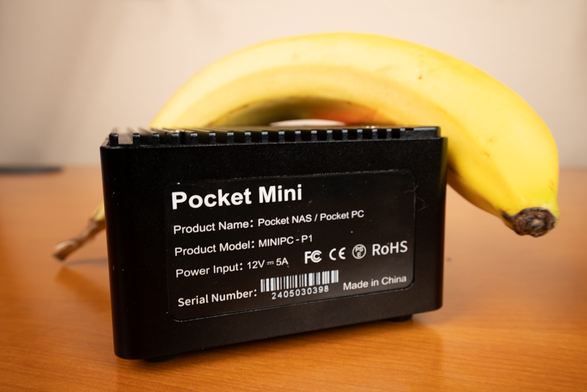 A banana next to the Pocket Mini NAS for scale.
