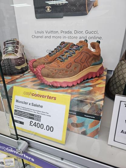 Sneakers in a display case, locked of course, with a cashies label stating a price of four hundred Sterling. Double u tee fuck.