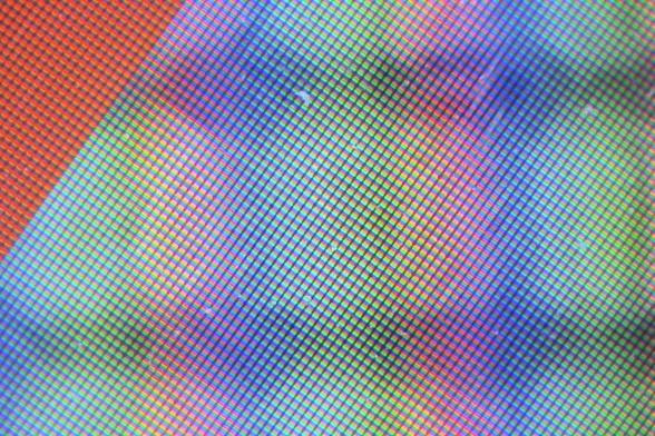 Abstract detail of a laptop screen in desperate need of a good clean