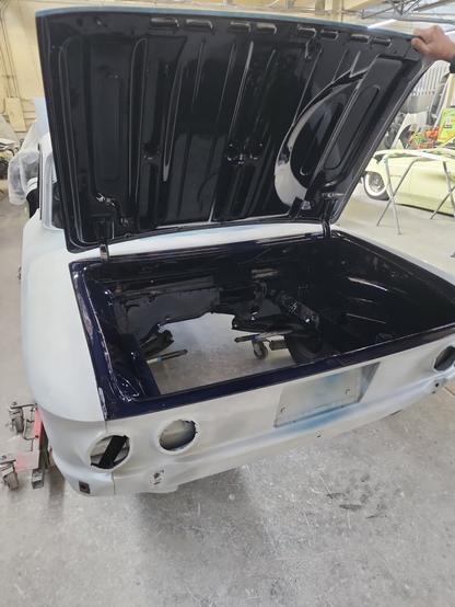 Engine bay of of 1964 Corvair, freshly sprayed with paint