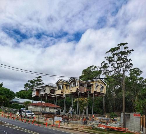 The two homes – at Simpsons Road in #Bardon – are under construction in an area which regularly floods & sit precariously on very high stilts.