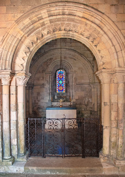 view into kings chapel at Dover Castle with the altar in the middle and the chapel window in the background