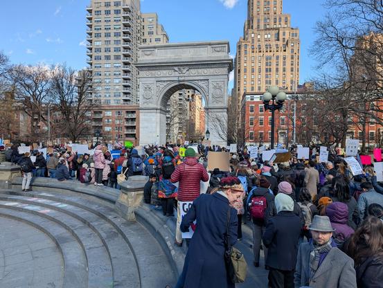 A gathering of protestors near the Washington Square Arch