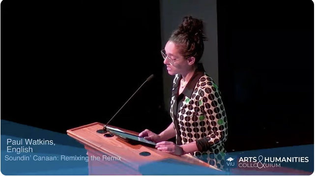 A women stands at a podium