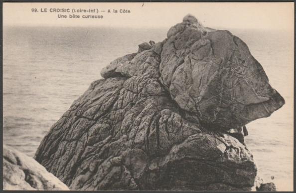 Printed monochrome postcard showing a view of the coastal rock formation known as Le Bête Curieuse or curious beast at le Croisic in Loire Atlantique, France.
Published by F Chapeau, Nantes, No 99, c.1920s.
Postally unused.
Very good condition, with very slight corner bumps.