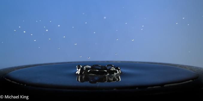 Small droplets of water surround the central crater