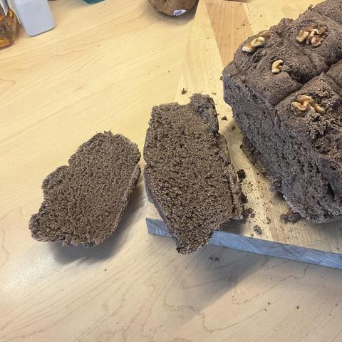 A loaf of freshly baked cacao bread after cooling and slicing.