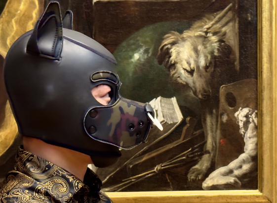 A close-up profile of a figure wearing a sleek black/camo neoprene puppy hood with pointed ears positioned mere inches from Domenico Fetti's 1610-1620 masterpiece "Melancholia." The wearer's head is tilted slightly, mirroring the downcast gaze of the sorrowful hound depicted in the painting. Both canine forms—one contemporary and crafted of leather, one Renaissance and rendered in oil—seem locked in silent communion across the centuries.

The figure wears an opulent gold and black brocade garment with swirling baroque patterns visible at the shoulder, creating a visual rhyme with the ornate gilded frame surrounding the artwork. The painting itself reveals a melancholic dog resting among artistic implements and scientific instruments—paintbrushes, a palette, and measuring tools scattered across a wooden surface. These objects symbolize the intellectual and creative pursuits that were significant to Fetti's patron, Ferdinando Gonzaga.

"Melancholia" hangs in Gallery 211 of the Art Institute of Chicago as part of their European Painting and Sculpture collection. Created during the early 17th century, the work exemplifies the allegorical painting tradition where animals often represented human emotions and virtues. The warm amber gallery lighting enhances the theatrical quality of this unexpected encounter between contemporary leather culture and Renaissance allegory on this early March evening, creating a poignant dialogue about expressions of melancholy and contemplation across