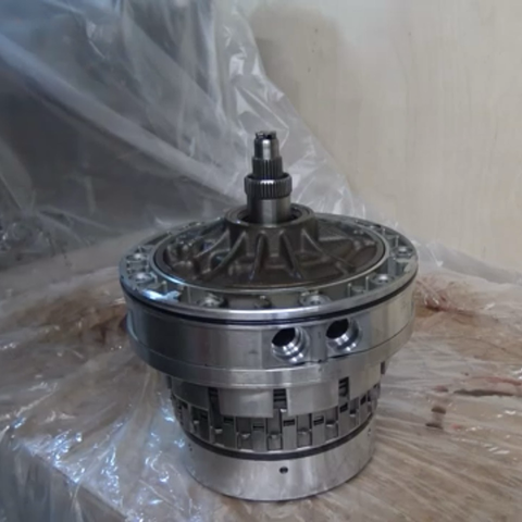 A screenshot from a YouTube video showing the large, heavy assembly of clutch packs and transmission oil pump that need to be installed to complete reassembly of the internals of my ZF 5HP19 five-speed automatic transmission.