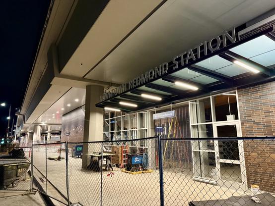 Downtown Redmond Station under construction with frontage signage and looking almost ready to open