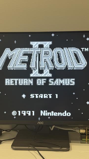 My 4K, 24-32bpp computer monitor displaying an original (1989) GameBoy game (Metroid II, 1991) with debut resolution of 160x144x2bpp monochrome. And I'd wager, by game quality alone, would still be more entertaining than 90% of the games playable on it. The original monochrome title screen is visible "Metroid II: Return Of Samus" with "Start 1" and Nintendo's copyright for 1991. The backdrop is stars.