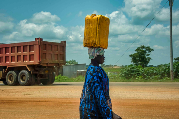 A women collects water in Juba, South Sudan. Image by Rod Waddington.