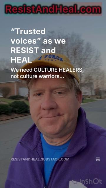 A man wearing a yellow cap and a purple jacket stands outdoors, appearing to take a selfie. The image includes text emphasizing the need for "culture healers" over "culture warriors." The background shows houses and trees, suggesting a suburban setting.
