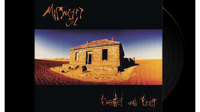 Image of the vinyl album cover for Diesel and Dust by Midnight Oil, 1987. Shows an old stone and brick structure with a rusty corrugated iron roof in an abandoned landscape.