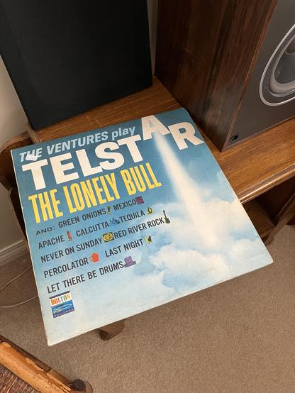 A 1962 mono copy of The Ventures Play Telstar, The Lonely Bull resting on a surface, showing its vintage cover design.