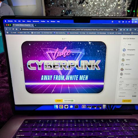 A photo of a laptop screen showing a large 80's vaporwave meme in a sticker ordering form. The sticker reads "take cyberpunk away from white men" in dynamic fonts.