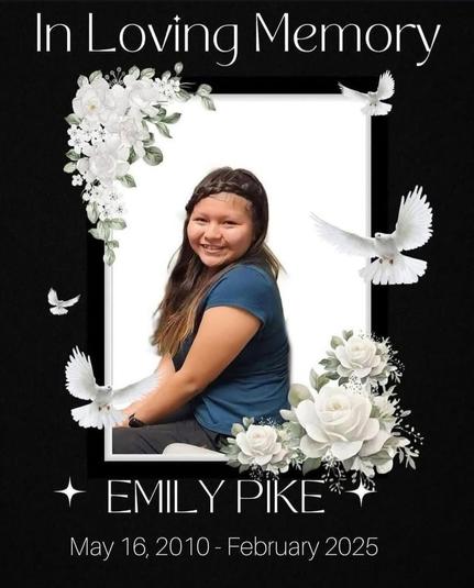 Photo of young teenager with long grown hair, a blue t-shirt and black pants on black background . The photograph is surrounded by effects of white roses and doves and white stars. Text: in loving memory of Emily Pike, may 16, 2010 - February 2025