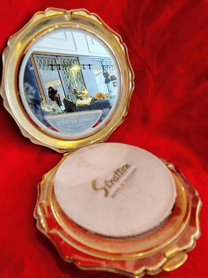 Open compact with mirror shown