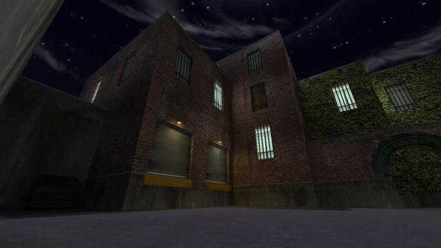 Also in this picture you can see the other larger stone brick building from a slightly different perspective. This time, however, you can also see the dumpster closer. In addition, you can see that there is an alley behind the passage. This is on the map cs_backalley in the game Counter-Strike 1.6.