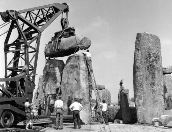 image of movie set stonehenge with crane putting rocks in place
