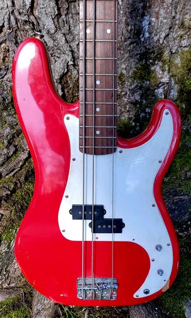 4 string Fender Squier Affinity bass front of body in candy apple red