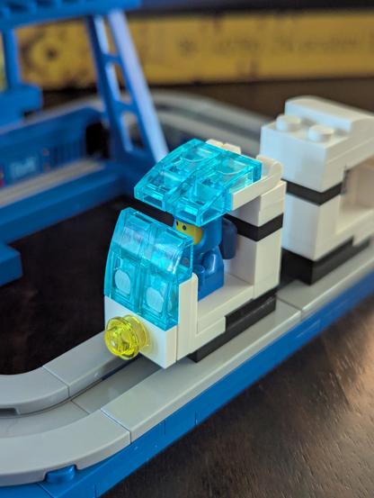 Close up of the tiny blue space person.
