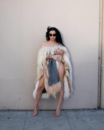 Charli XCX in transparent high heel mules