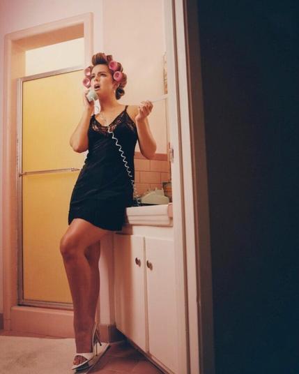 Addison Rae in high heel mules; bonus toe ring and curlers