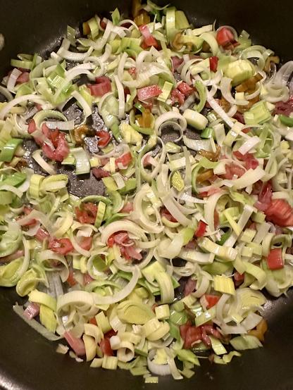 Thinly sliced leeks and chard stems - a gentle melange of light green and pinky purples.