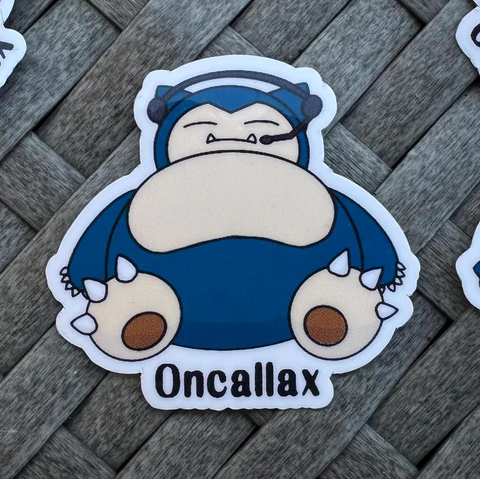 A sticker featureing a sleeping Snorlax wearing a headset. The word "Oncallax" is below.