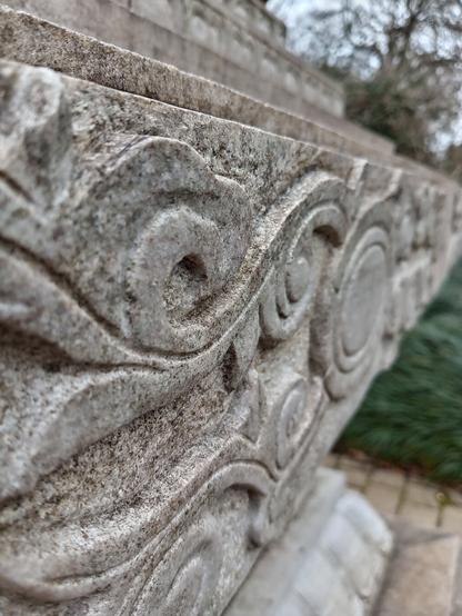 Carved stone of a Chinese monument.