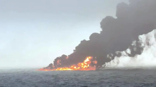 Image shows a large fire that is spread across the North Sea and thick black smoke billowing upwards
