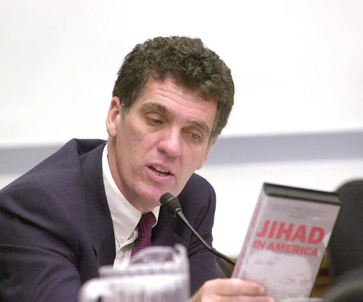 Dave Weldon holding video "Jihad in America"