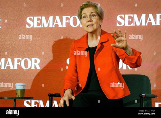 Sen. Elizabeth Warren (D-MA) speaking at a news conference, 6 Mar. 2025, in an Alamy frame and watermarks.