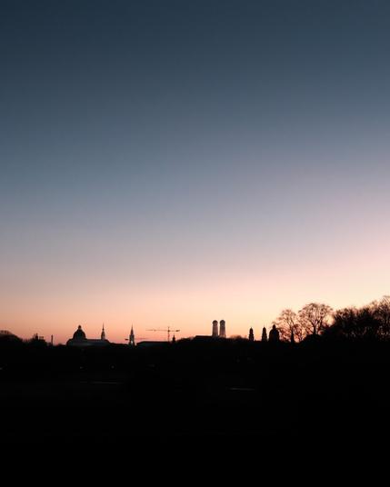 Basking in the tranquil hues of dusk, this silhouette captures the essence of a fading day. The blend of deep blues and soft pinks creates a serene backdrop, highlighting the architectural outlines that define the skyline. Trees stand tall alongside historic structures, hinting at stories waiting to be told as night begins to fall. A peaceful end to an inspiring day. 

#Sunset #Silhouette #Skyline #Photography #Landscape #UrbanPhotography #Nature #Dusk #ColorGradient #VisualStorytelling