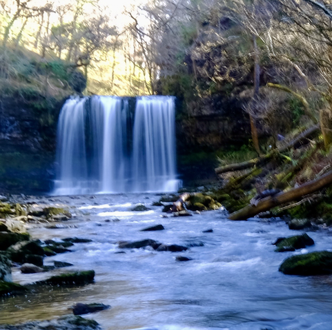 Photograph of a waterfall (Sgwd yr Eira), in The Brecon Beacons