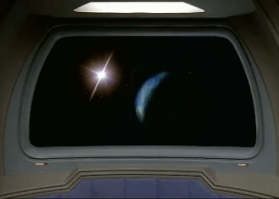 Screenshot from Star Trek DS9 episode "Meridian" where a planet suddenly appears on the viewscreen.
