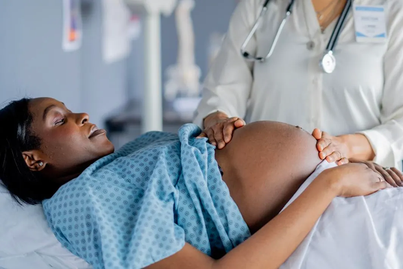 Pregnant woman being examined