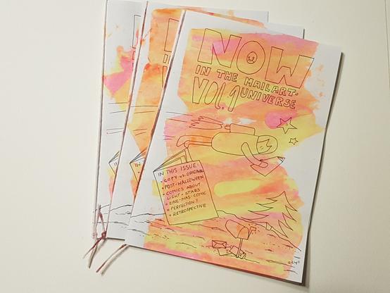 cover of a hand drawn comic-zine with neon colours added."Now in the mailart universe Vol. 1"  a flying rabit-astronaut holding a zine in its hand.