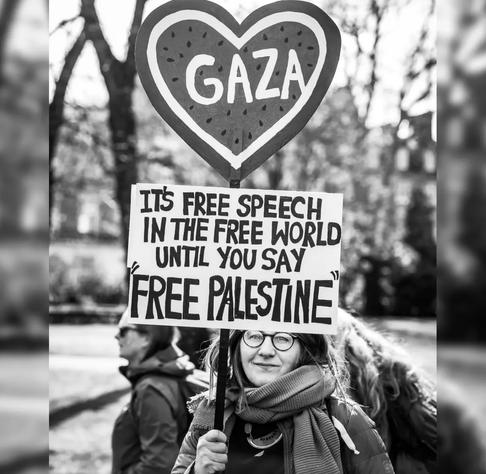 Woman holds a sign