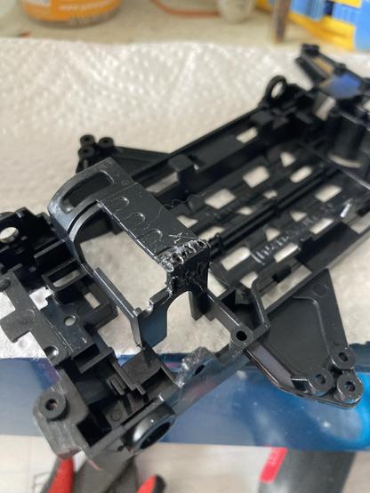 The bent part of the motor mount has been stressed a few more times and then crudely glued in, and the seams gone over with a soldering iron to brutally melt them together.