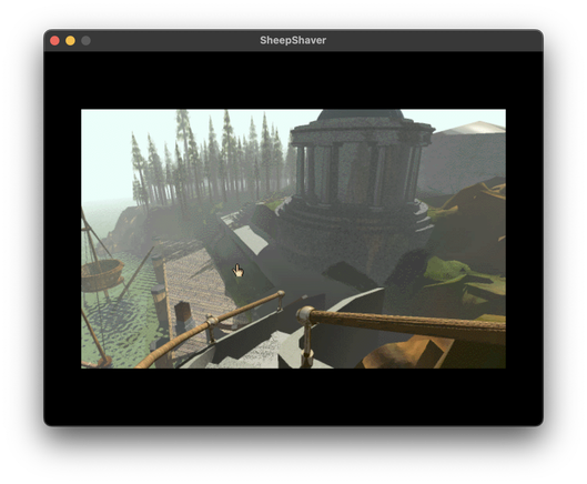 Screenshot of MYST running in a SheepShaver emulator window. 

View from top of spiral staircase looking down outside. Forest in background. Water and boat on left. Old white stone circular building with blue dome at center.