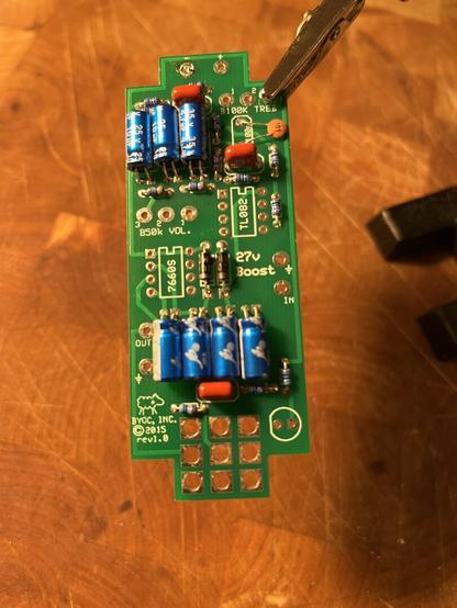 Close up of printed circuit board with resistors soldered in place.
