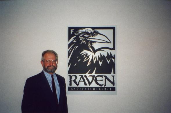John F. Mullins next to the Raven Software logo