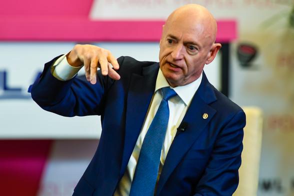 Sen. Mark Kelly (D-AZ) answers a reporter's question.