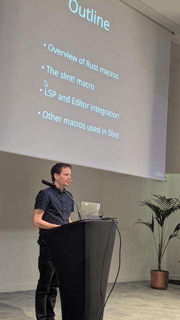 Olivier Goffart in front of the Outline slide.