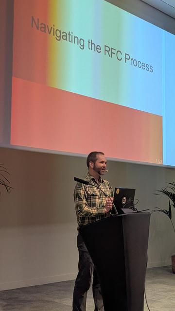 Ed Page in front of the title "Navigating the RFC Process".